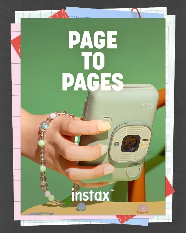 Ad image of a hand holding an instax camera