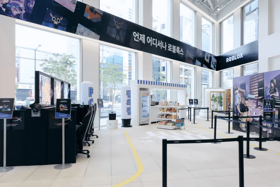 Bright store interior with game screens and queue lines
