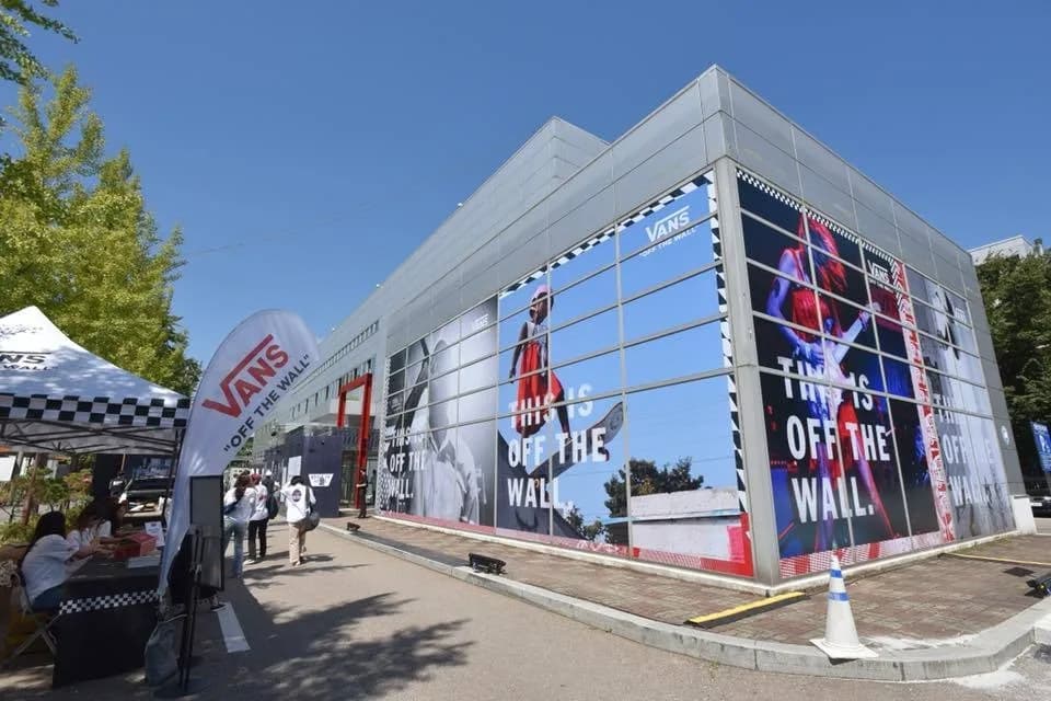 S-Factory building dressed in large event graphics